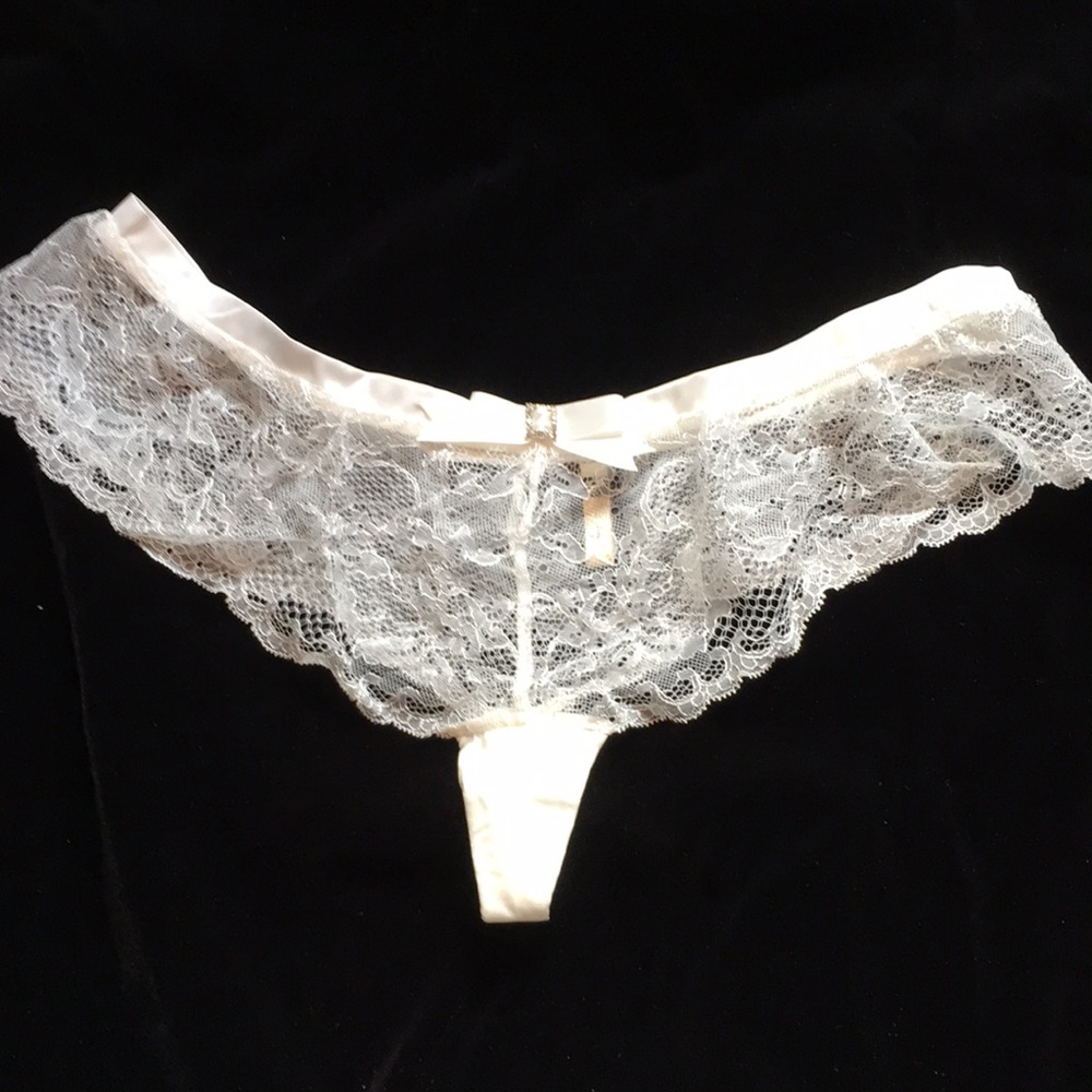 NWOT Ivory Lace and Satin Thong. Size 8